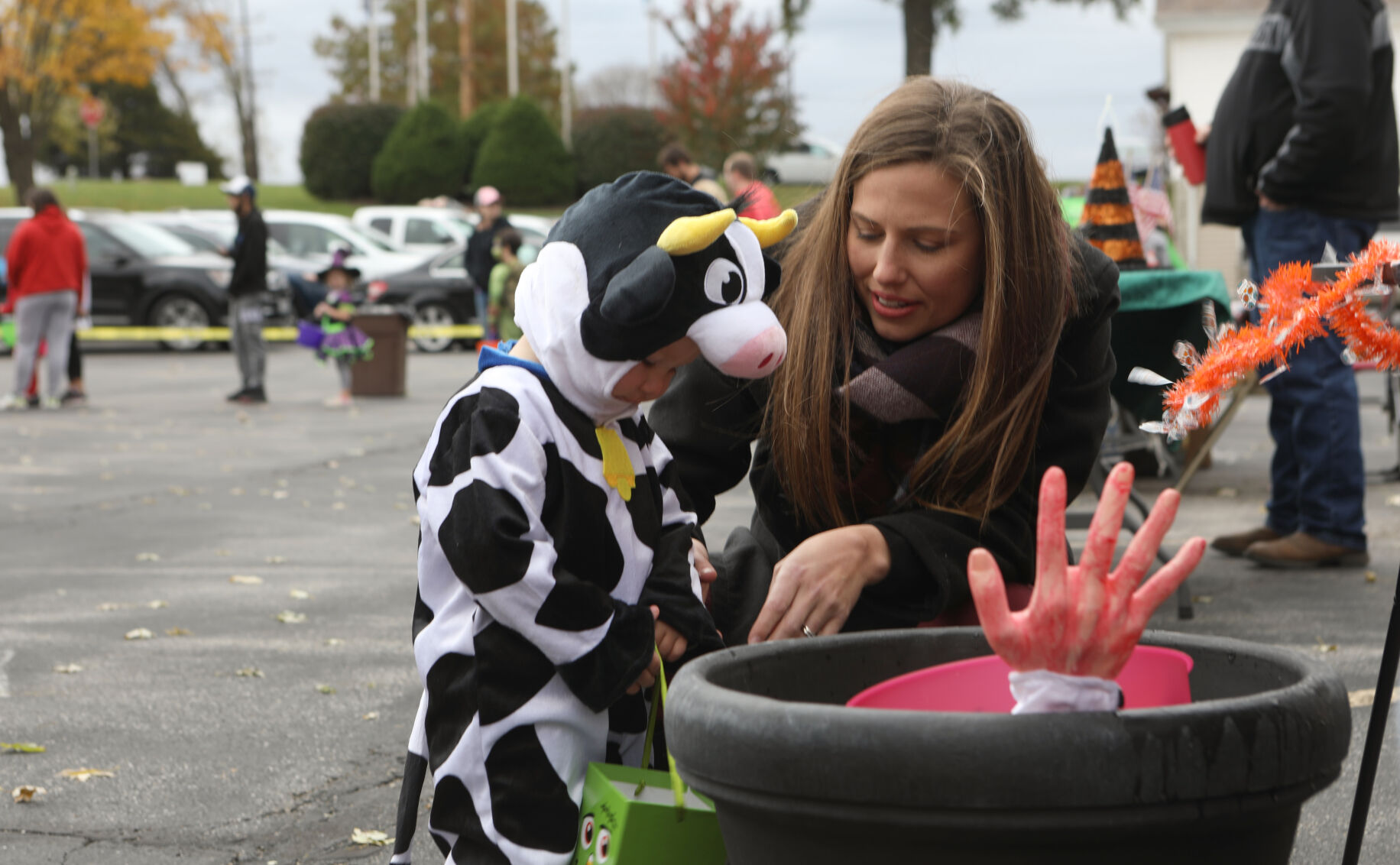 Julia McDonald helps Layton get candy